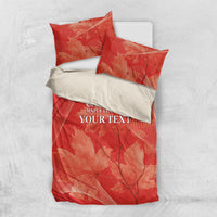 Flat lay of red duvet cover with two pillow shams, maple leaf pattern and text