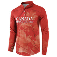 Red button-front sweatshirt with Canada Maple Leafs logo and maple leaf graphic