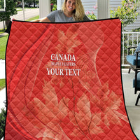 Red quilt with diamond quilting and white 'CANADA MAPLE LEAFERS YOUR TEXT' print