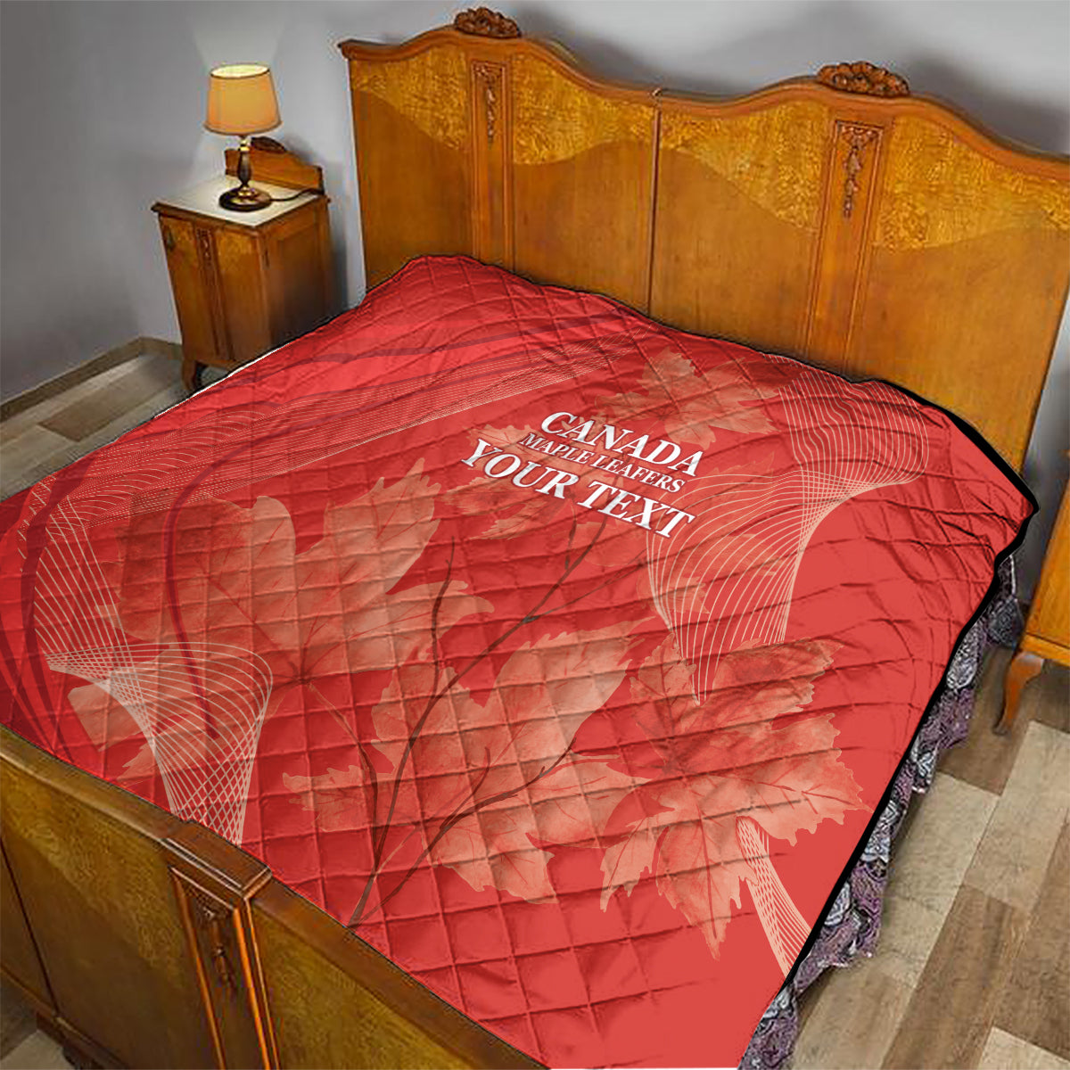 Red quilt on bed with diamond quilting and white 'CANADA MAPLE LEAFERS YOUR TEXT' print