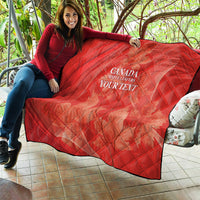 Red quilt draped on outdoor seating with diamond quilting and white 'CANADA MAPLE LEAFERS YOUR TEXT' print