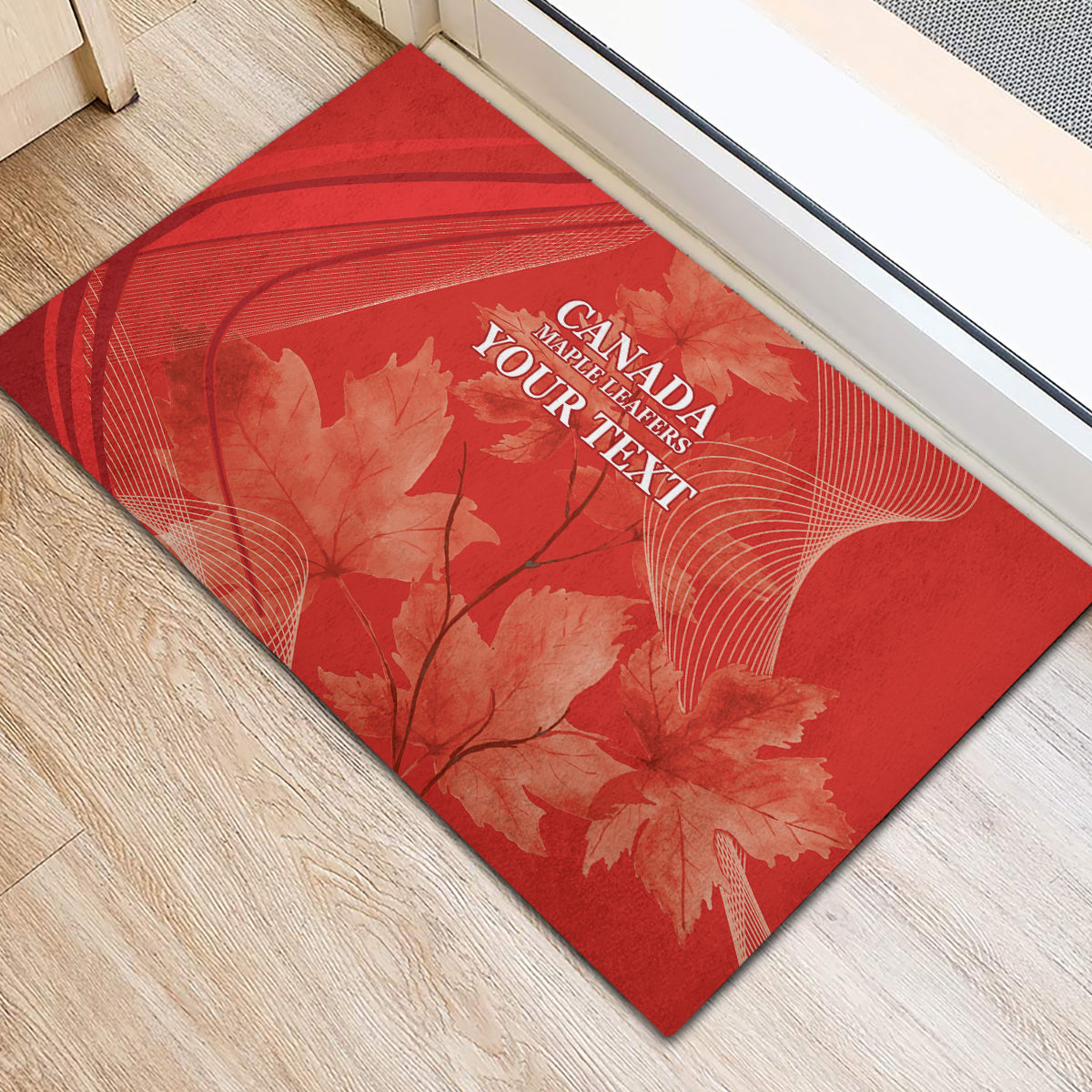 Red rubber doormat with diagonal maple leaf and white Canada Maple Leafers lettering