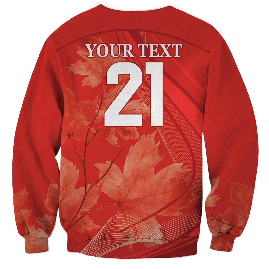 Red crewneck sweatshirt back with large 21 number and maple leaf graphic
