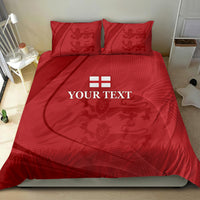 Red bedding set with duvet and two pillowcases, central emblem and crest print