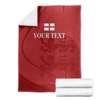 Red cricket blanket with white England emblem and 'YOUR TEXT' folded with two white towels