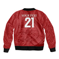 Red bomber jacket with black rib trim and front zip; large back print with number 21