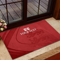 Red rubber doormat with YOUR TEXT and lion crest, rectangular front view