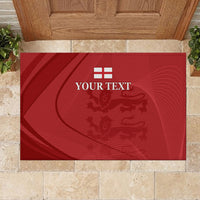 Red rubber doormat with YOUR TEXT and lion crest graphic, at entryway