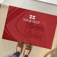 Red rubber doormat with YOUR TEXT lion crest design, with shoes on edge