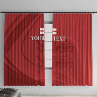 Red window curtain pair with custom text and abstract crest pattern, wall-hung view