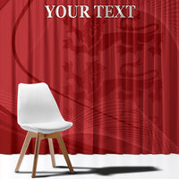 Red window curtain close-up with custom text and abstract emblem pattern