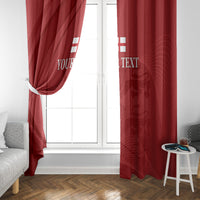 Red window curtains with custom text and abstract emblem pattern, full-length view