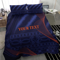 Blue duvet and two pillowcases from a bedding set, dark blue pattern with red-orange swooshes