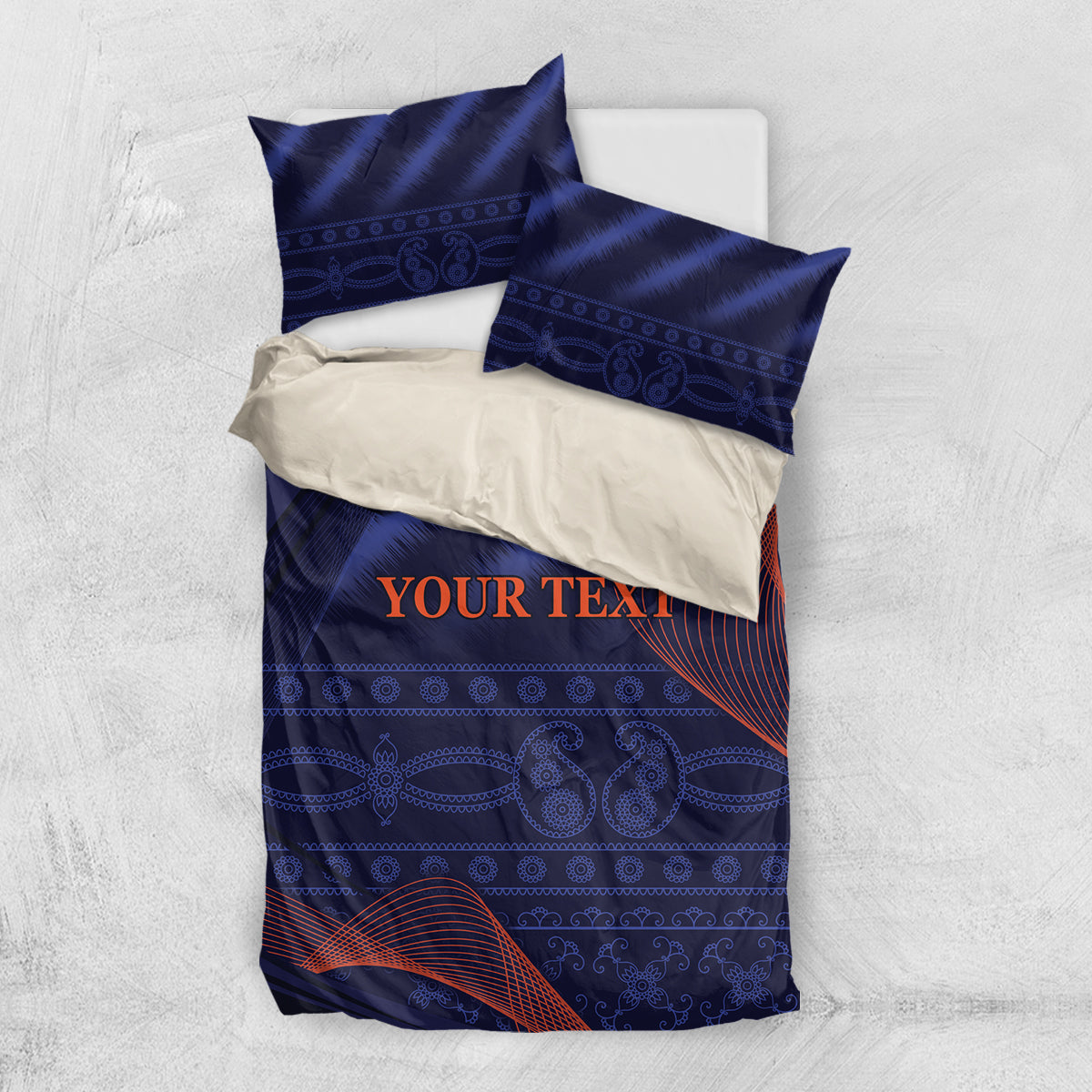 Blue bedding set with duvet and two pillowcases, centered “YOUR TEXT” on patterned fabric