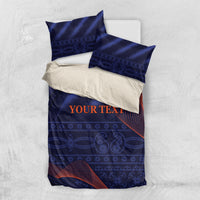 Blue bedding set with duvet and two pillowcases, centered “YOUR TEXT” on patterned fabric