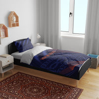 Blue bedding set with duvet and two pillowcases, diagonal red-orange lines on geometric print