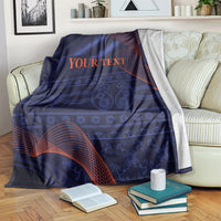 Blue blanket with red wave pattern and 'YOUR TEXT' text across center