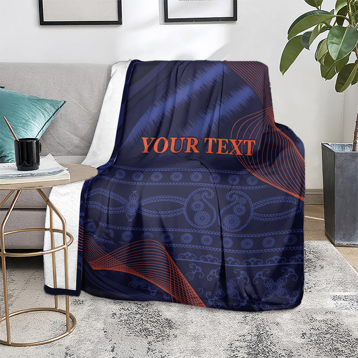 Blue blanket with red wave pattern and 'YOUR TEXT' text, draped