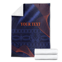 Blue blanket with red wave stripes and 'YOUR TEXT' text, folded
