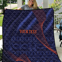 Blue quilt with diamond stitching and red swirling graphic, centered “YOUR TEXT”