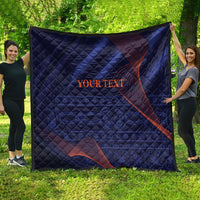 Blue quilt with red wave lines and diamond quilting, “YOUR TEXT” printed on center