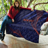 Navy-blue quilt with diamond stitching and red curved lines, “YOUR TEXT” on panel