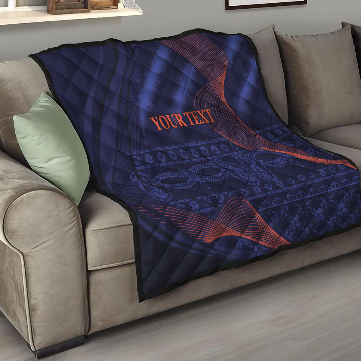 Blue quilt blanket with red wave pattern and “YOUR TEXT” text on the top