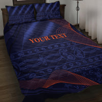 Blue quilt bed set with matching pillowcases, orange 'Your Text' across patterned surface