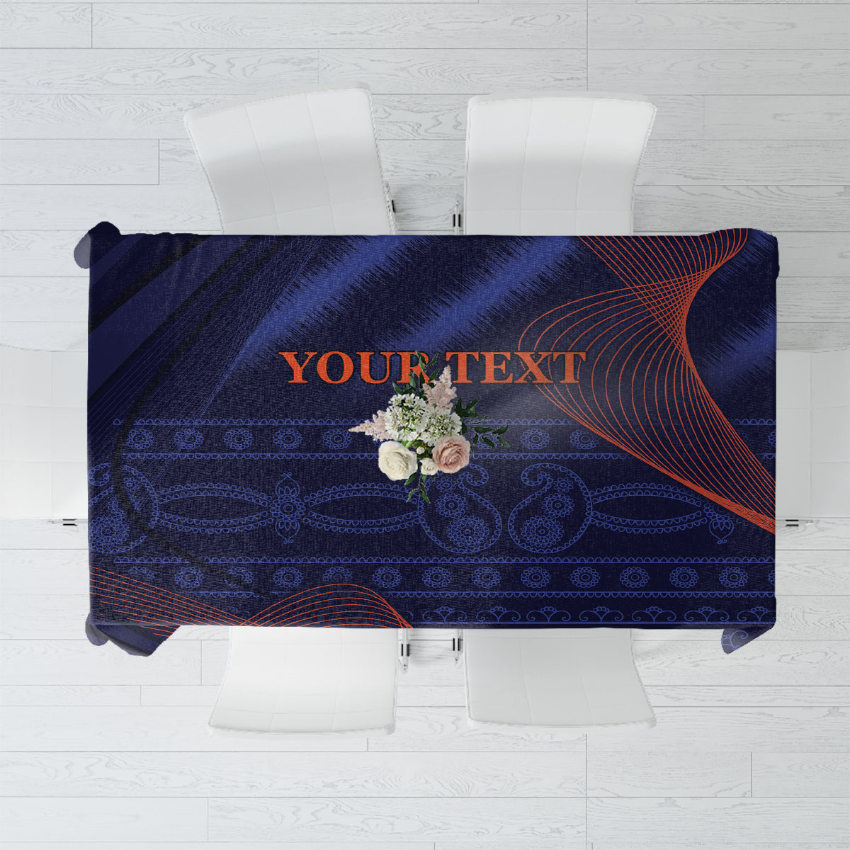 Blue tablecloth with dark ornamental pattern and orange-red swirl accents, “YOUR TEXT”