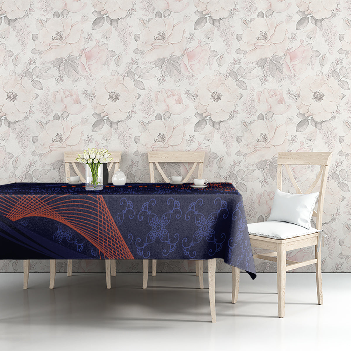 Blue tablecloth with orange-red swirls and dark floral scroll pattern on sofa table