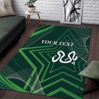 Green area rug with geometric star pattern, Arabic-style script, and “YOUR TEXT”
