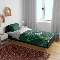Green geometric bedding set on bed: duvet and two pillowcases with star print