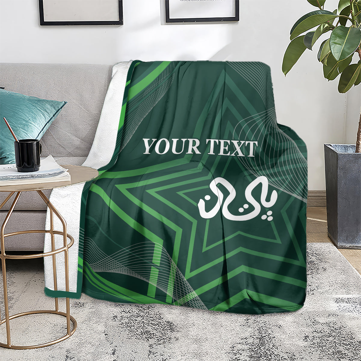Green patterned blanket on a sofa seat with “YOUR TEXT” and calligraphy emblem