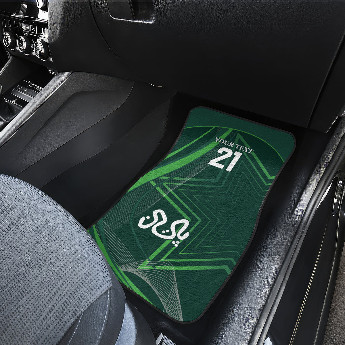 Green car floor mat with '21' and Arabic emblem, rear seat close-up