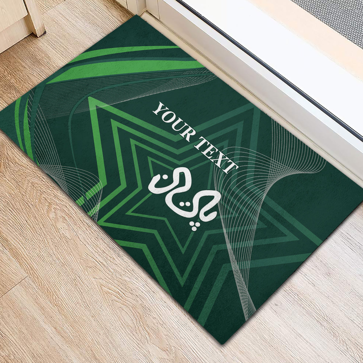 Green rubber doormat, angled view, with geometric star and white 'YOUR TEXT' in center