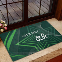 Green rubber doormat with geometric star, white 'YOUR TEXT' and decorative emblem