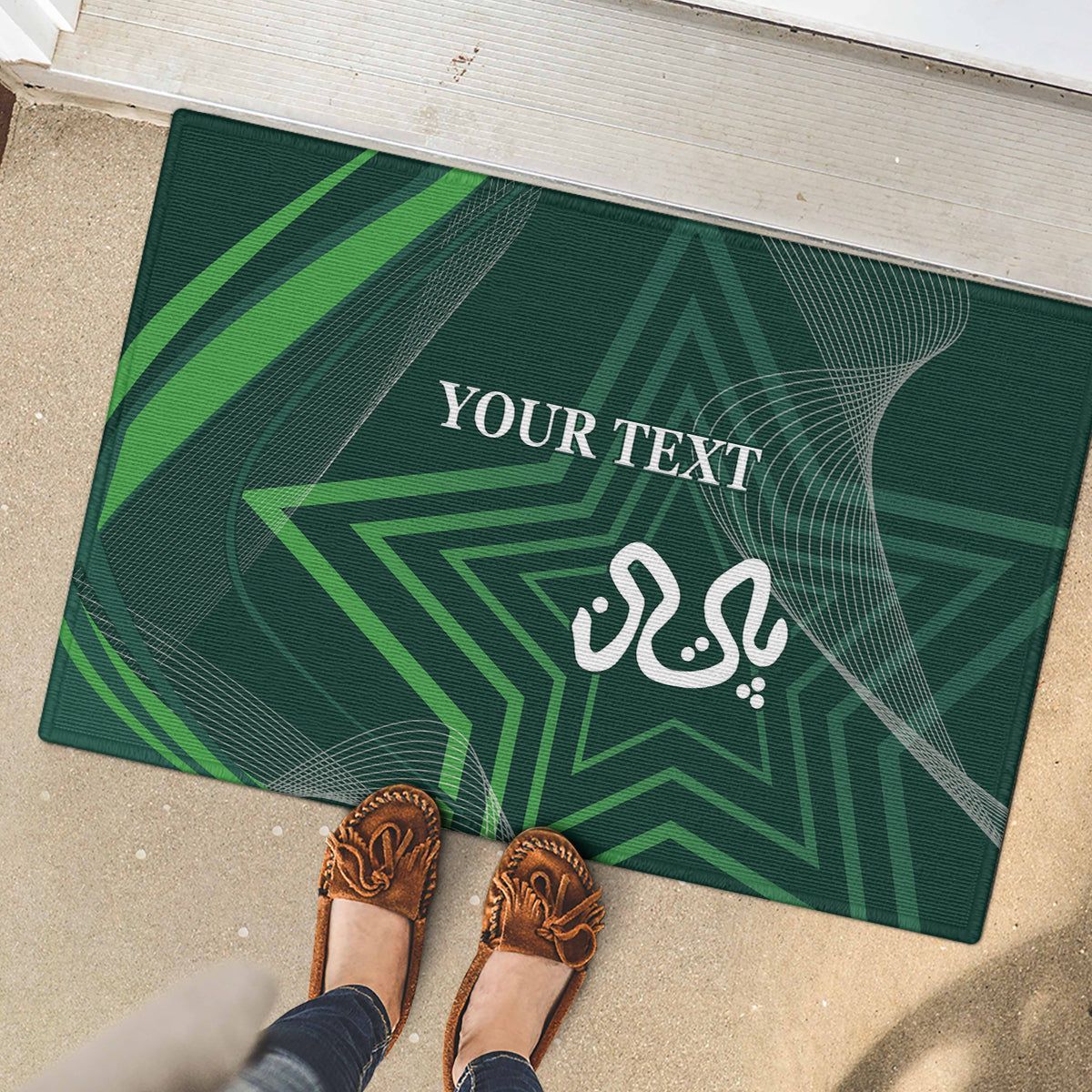 Green rubber doormat with geometric star lines and white 'YOUR TEXT' design with shoes