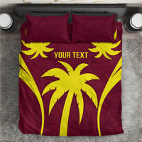 Maroon and yellow palm print duvet and pillow covers, top view