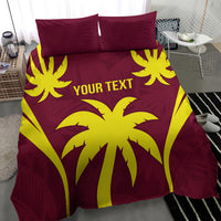 Maroon and yellow palm print bedding set with pillows and "YOUR TEXT" center