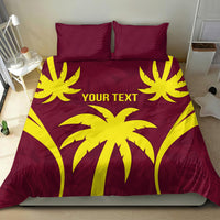 Maroon and yellow palm print duvet set with two pillows on a bed