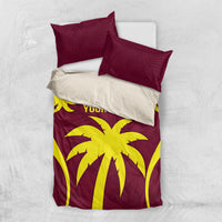 Flat-lay maroon and yellow palm print duvet set with two pillowcases