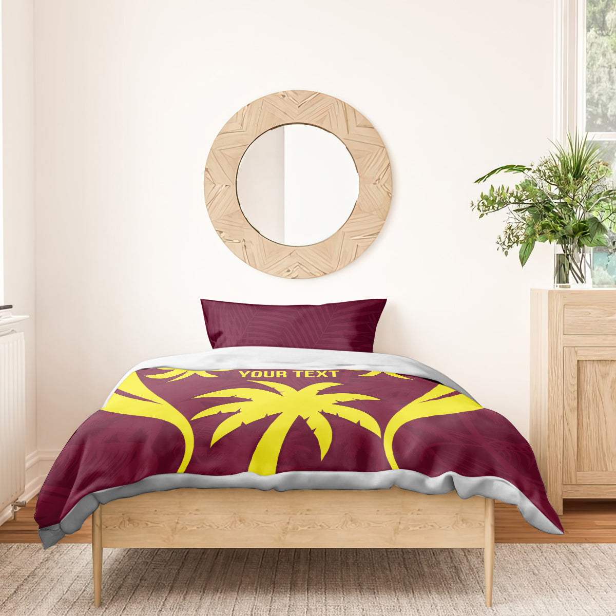 Maroon and yellow palm print bedding set on a wooden bed with two pillows