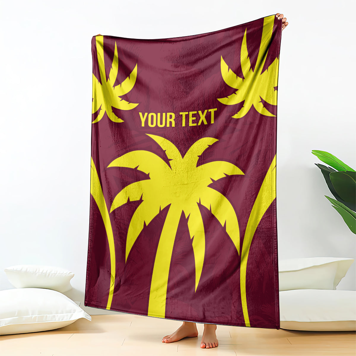 Maroon blanket with large yellow palm-and-sunburst design and "YOUR TEXT" lettering