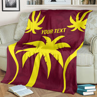 Maroon blanket with bold yellow burst artwork and "YOUR TEXT" text, draped on couch