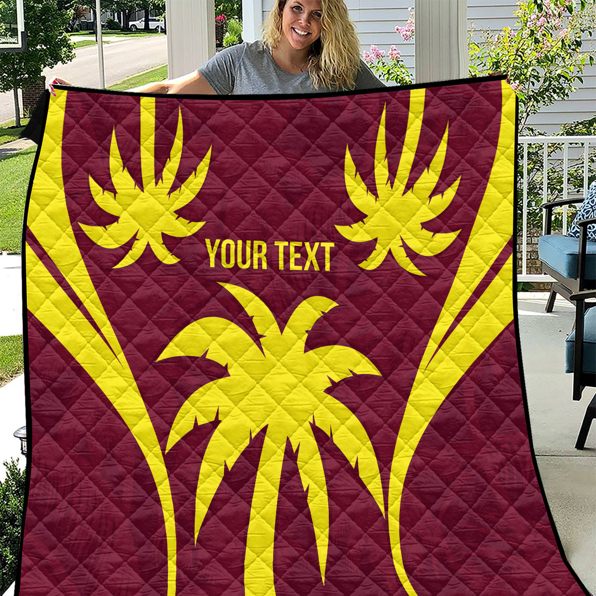 Maroon quilt blanket with yellow palm graphics and 'YOUR TEXT' on full front