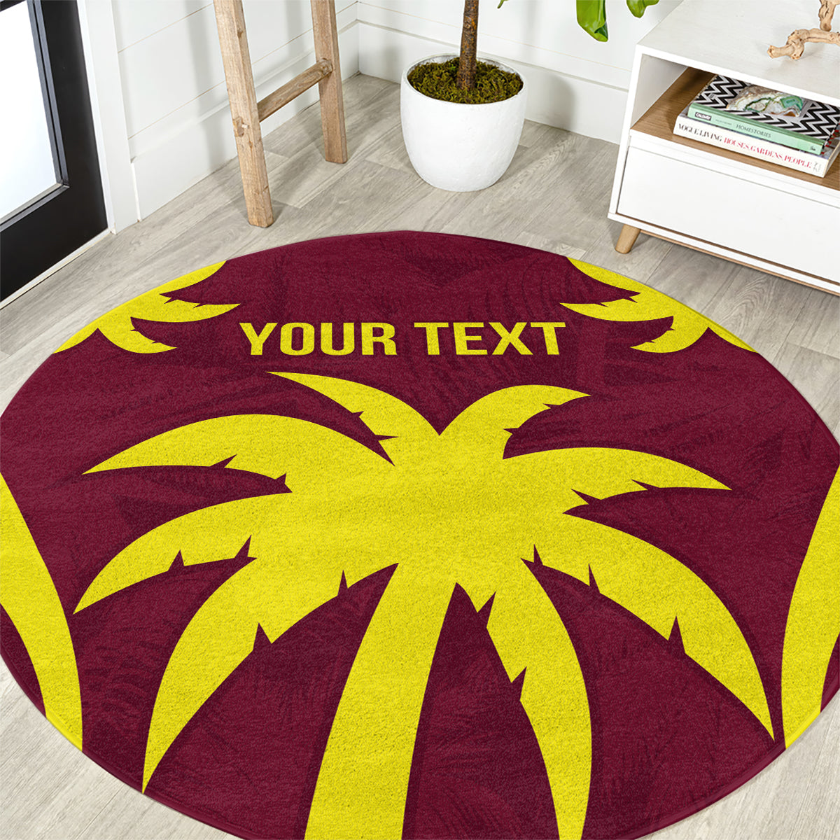 Maroon round rug with large yellow palm burst and YOUR TEXT lettering