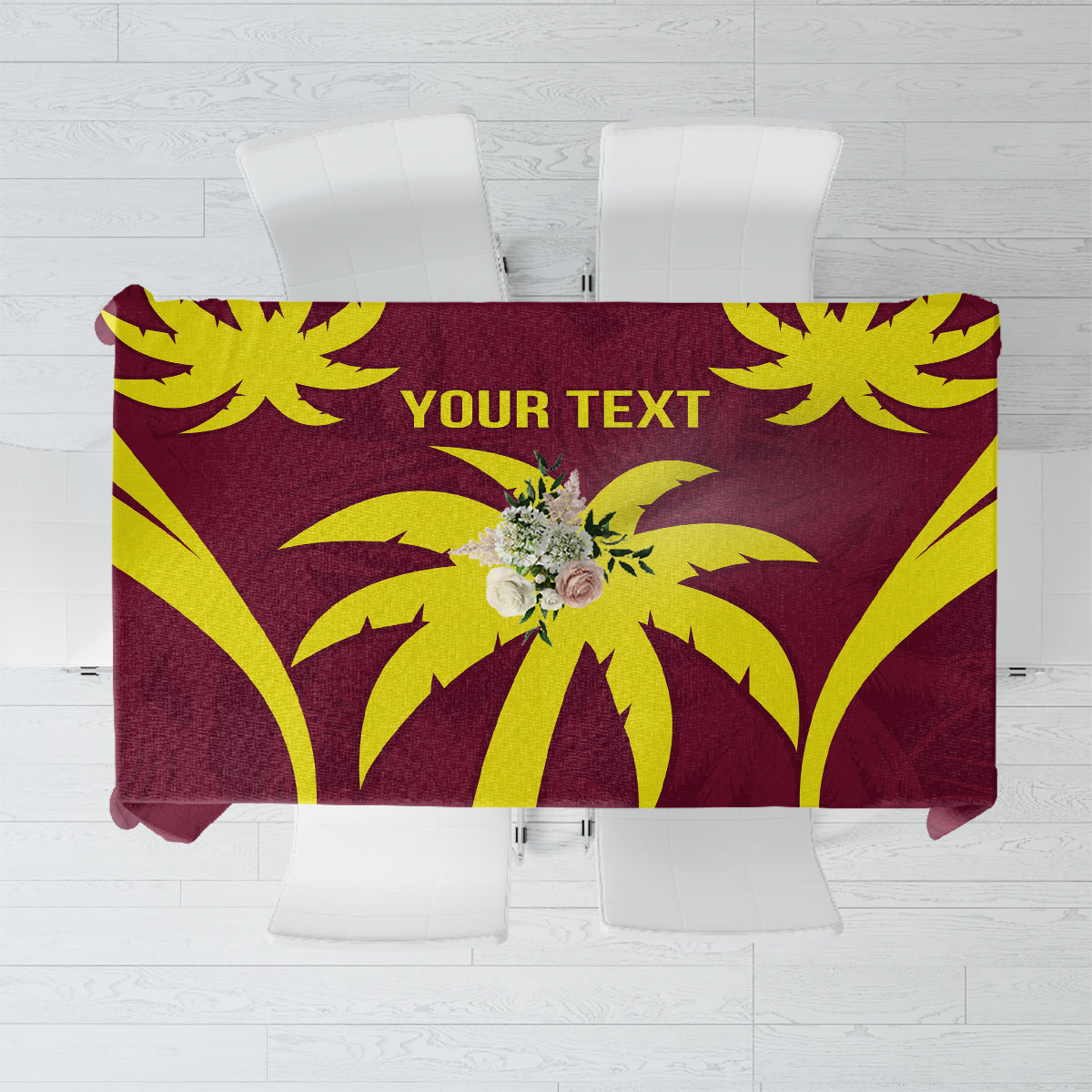 Maroon and yellow cricket-themed tablecloth with floral emblem and abstract burst pattern