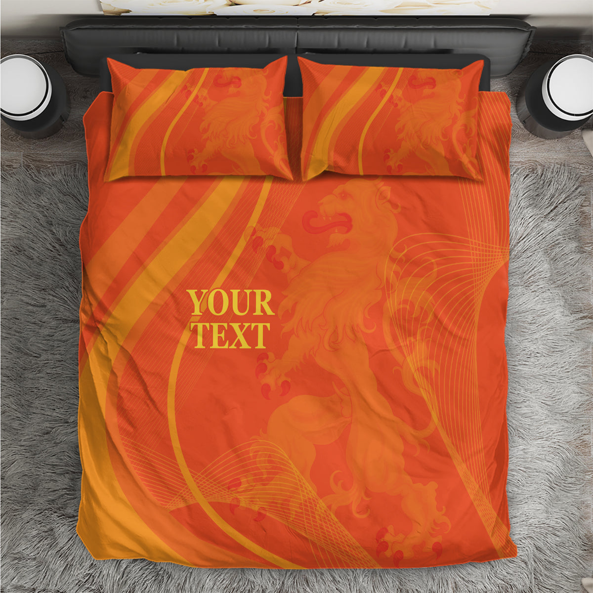 Orange bedding set photographed from above: duvet and 2 pillowcases with 'YOUR TEXT'.