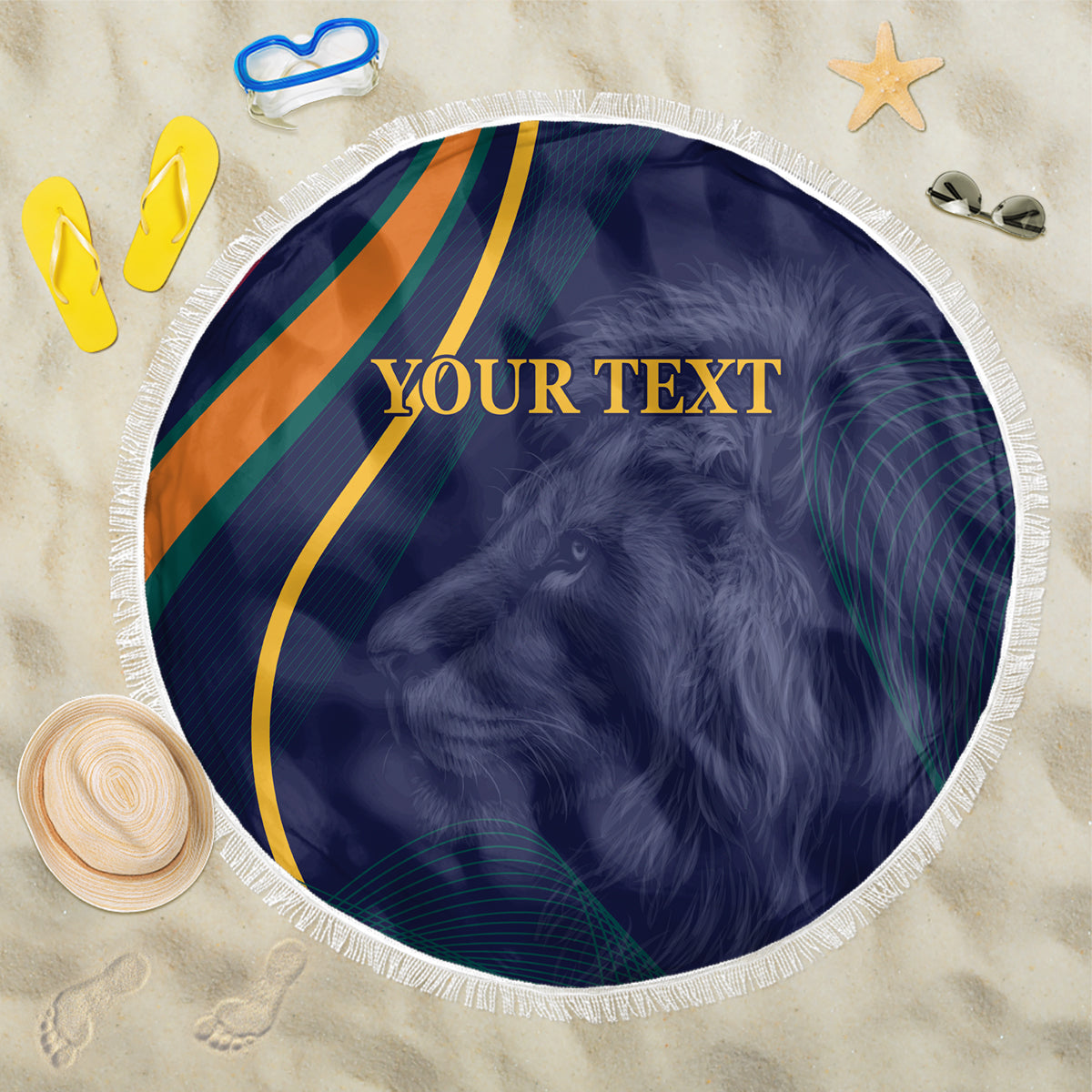 Blue circular beach blanket with lion portrait, multi-color stripes, white fringe border; flat lay