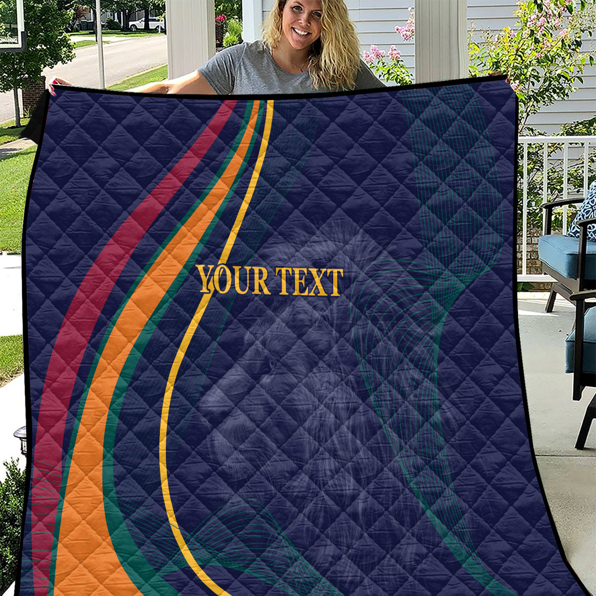 Blue quilt with diagonal multicolor stripes and centered “YOUR TEXT”